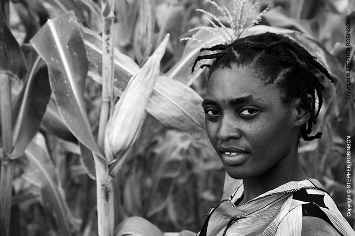 008_AgCF.0296BW-Woman-Conservation-Farmer-&-maize-crop-Zambia