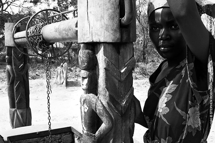 007_CZmA.8803BW-African-Village-Woman-&-Carved-Water-Well