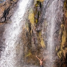 034_TZmN.7715V-Man-Under-Waterfall-N-Zambia