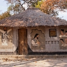 001_CZmA.8530-African-Painted-House-Jesus's-Barbshop-NW-Zambia