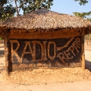 012_CZmA.8664-African-Painted-House-Radio-Repair