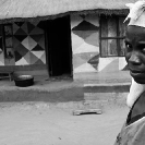 019_PZmN.8075BW-African-Painted-House-&-Owner-N-Zambia