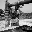 028_CZmA.8344BW-African-Village-Woman-&-Carved-Water-Well-NW-Zambia